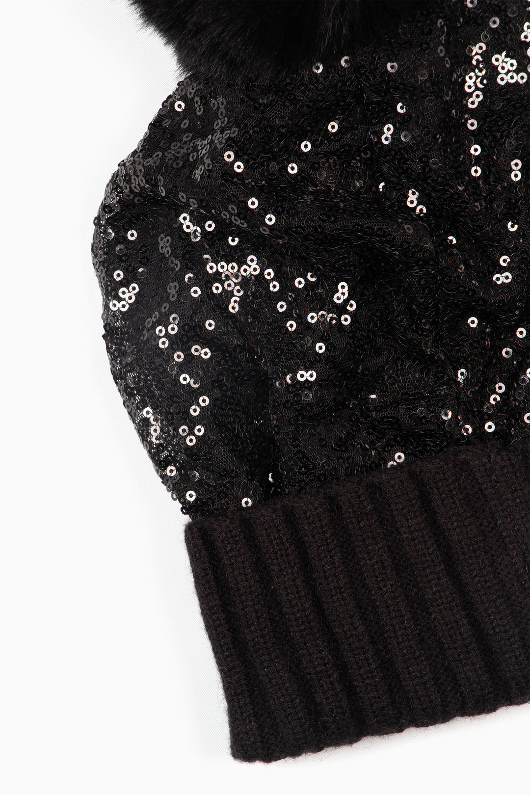 close up of the sequin and contrasting ribbed knitted rim of the hat.