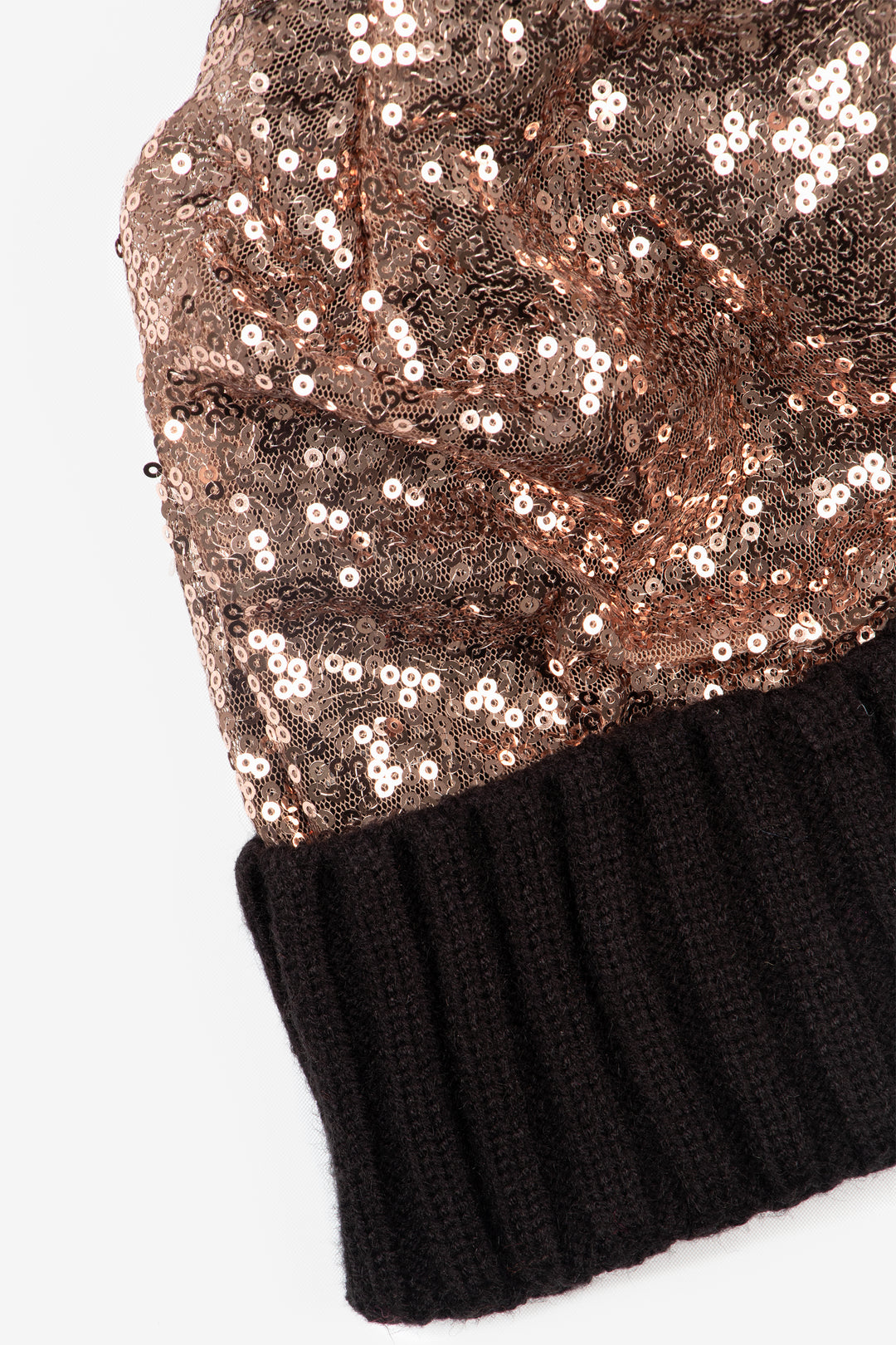 close up of the sequin and contrasting ribbed knitted rim of the hat.