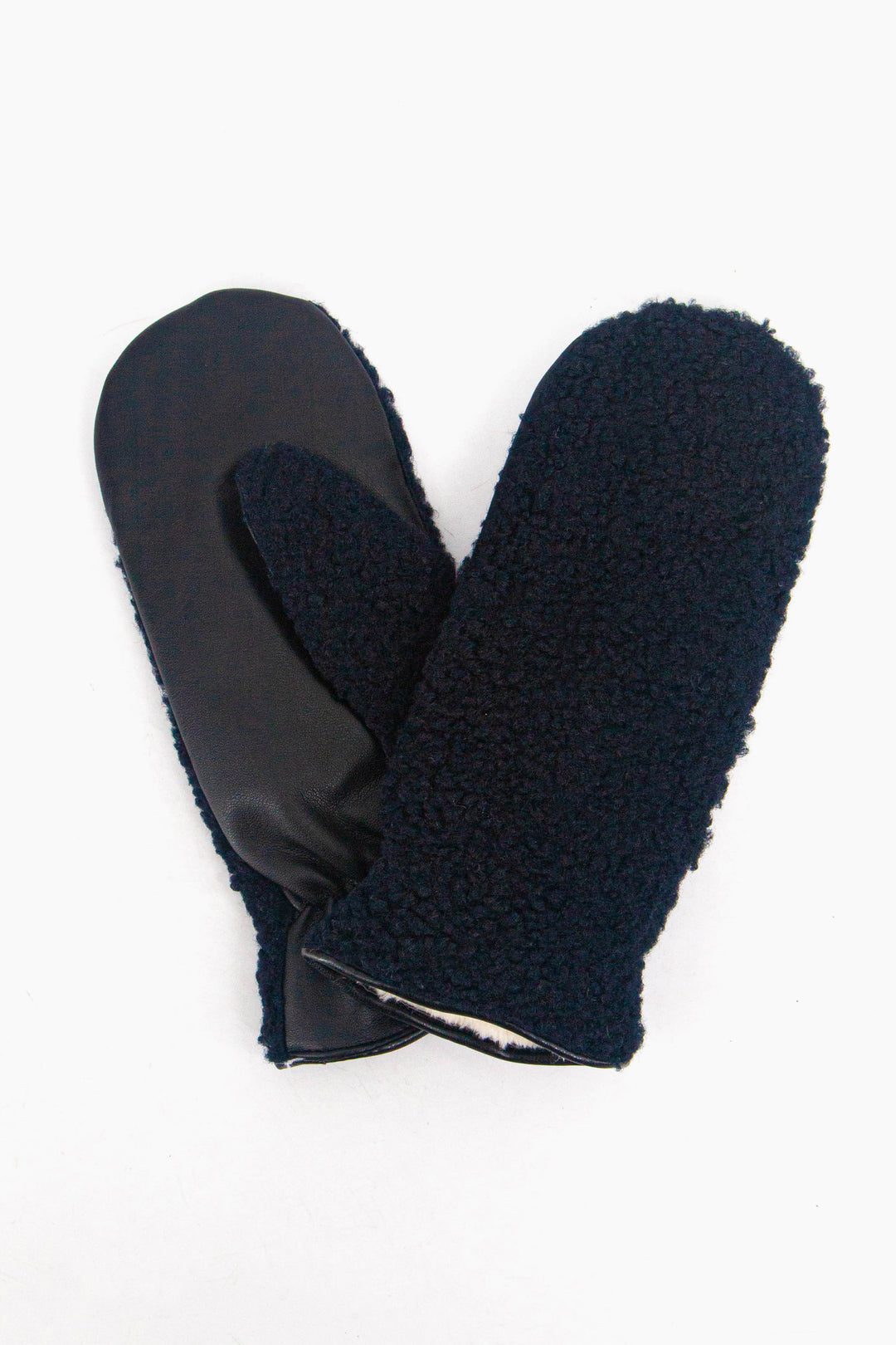 showing the gloves close up, there is an inner lining which is white, the trim around the edge of the cuffs is polyester.