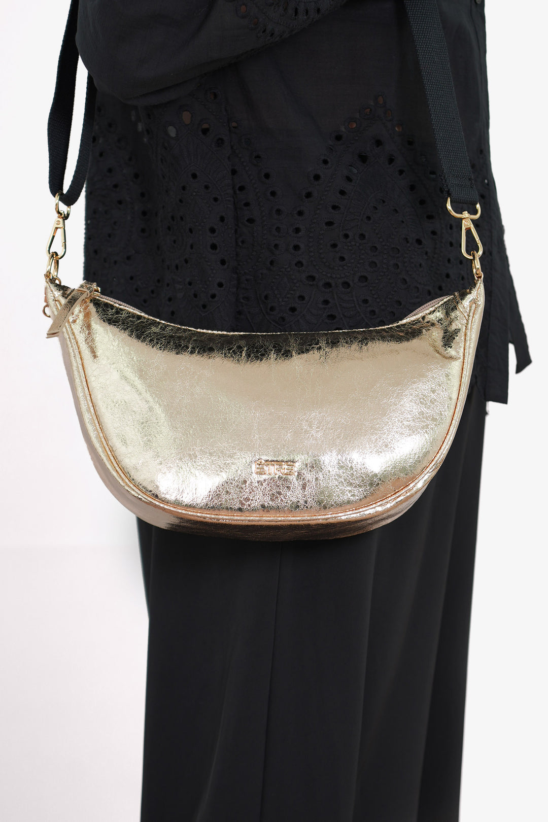 bellamy-half-moon-crossbody-bag-gold-cracked-metallic-worn-by-model