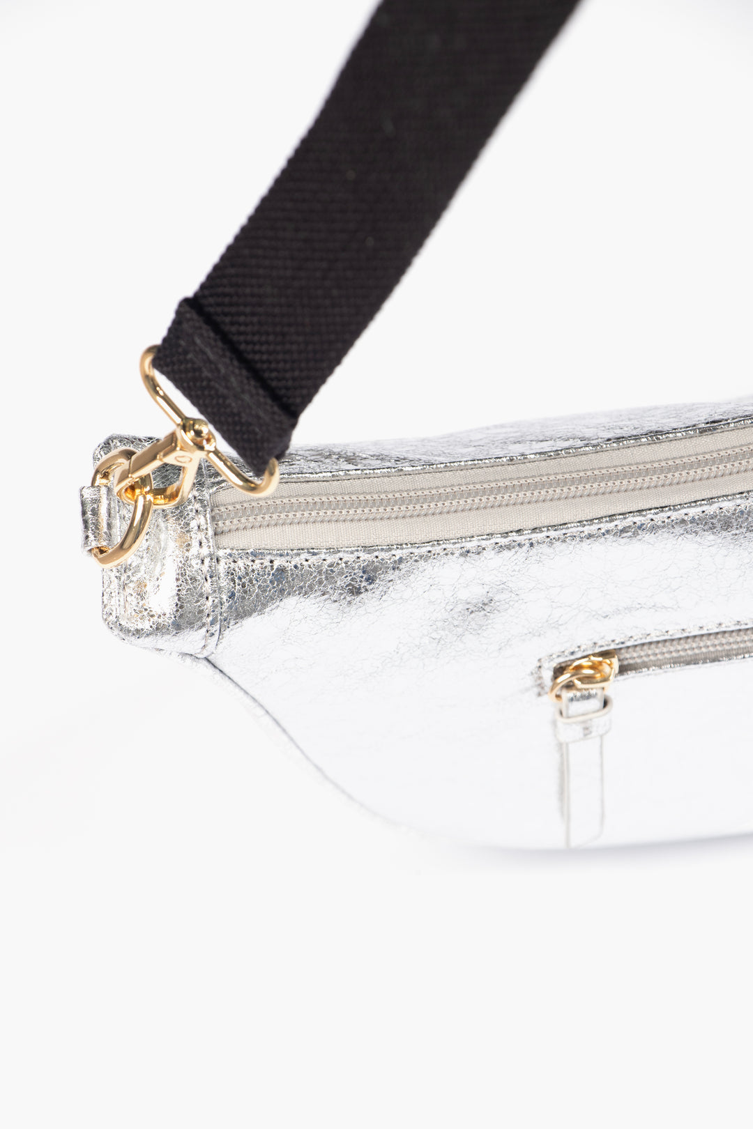 showing the top zipper compartment and a smaller side pocket which is also has a zip closure.