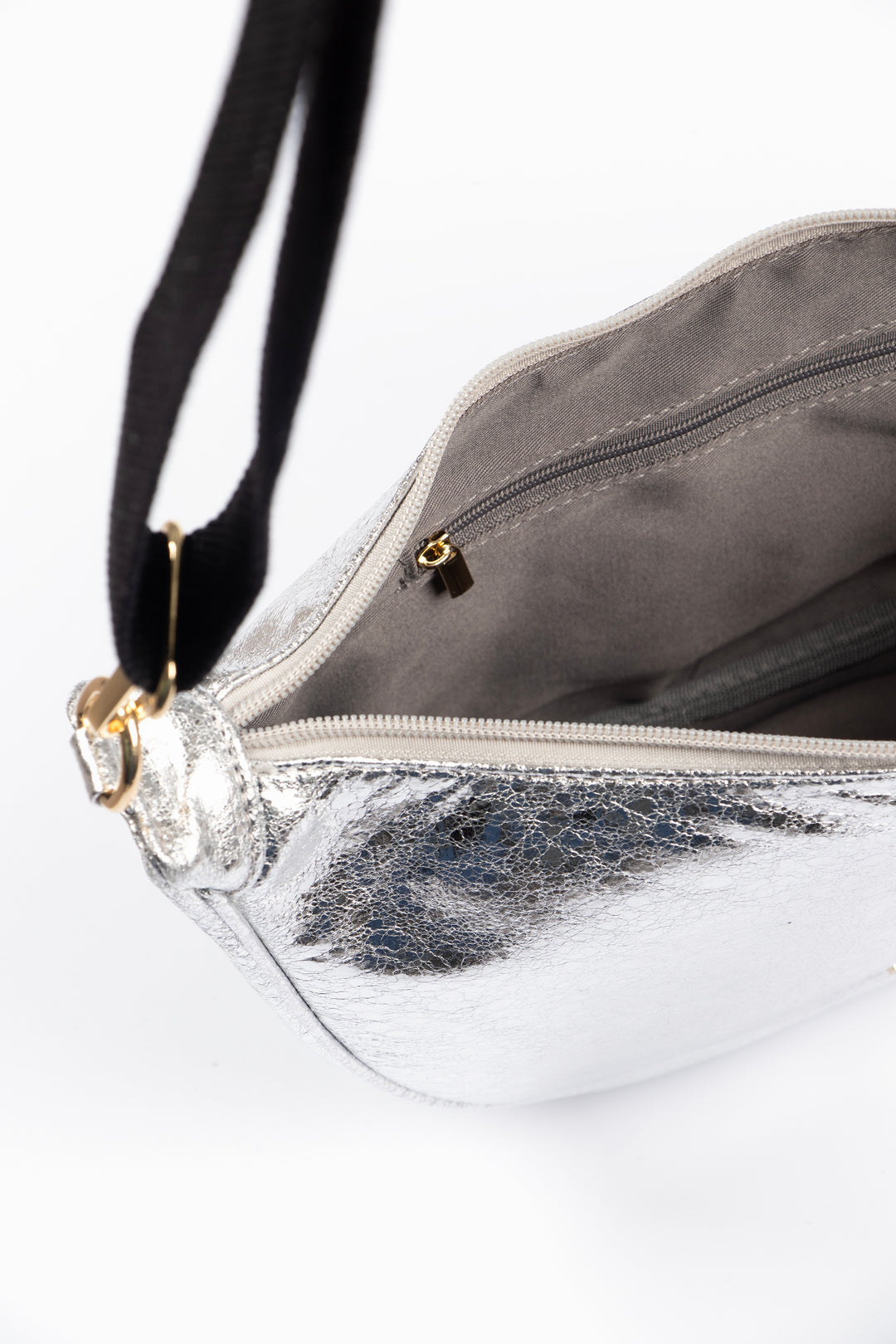 showing the bag unzipped, there is an internal zip closure pocket visible