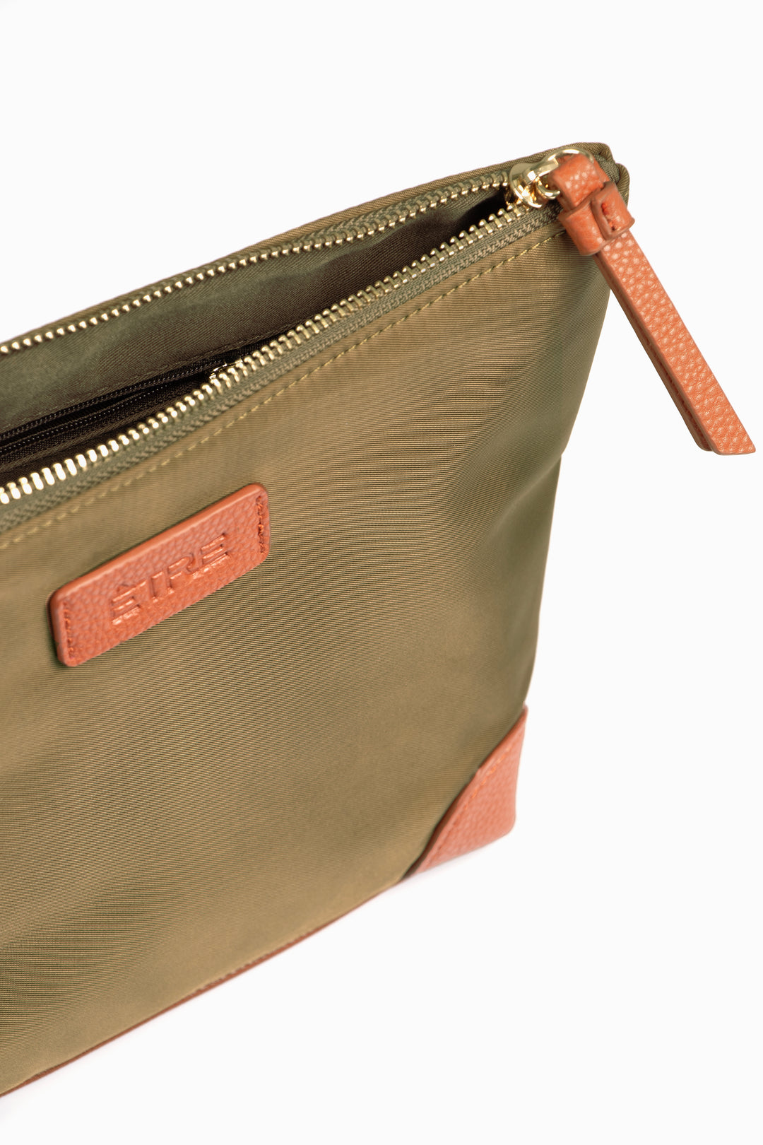 showing the zip closure on the top of the bag, there is also a small internal side pocket visible on the inside