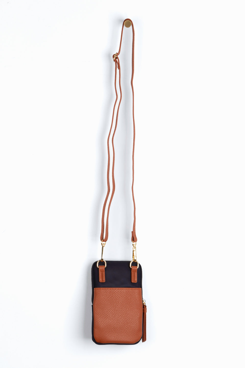 showing the back of the phone bag, there is a tan faux leather external open pocket.