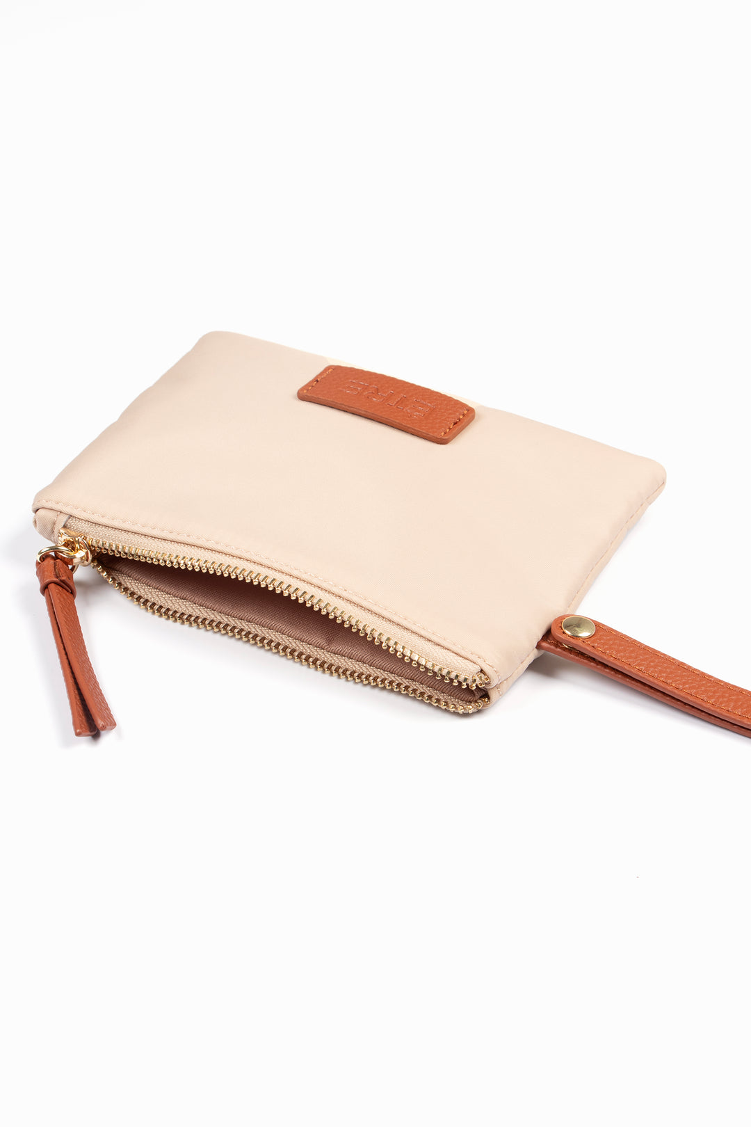 showing the purse laying flat, the zip is open showing a single compartment.