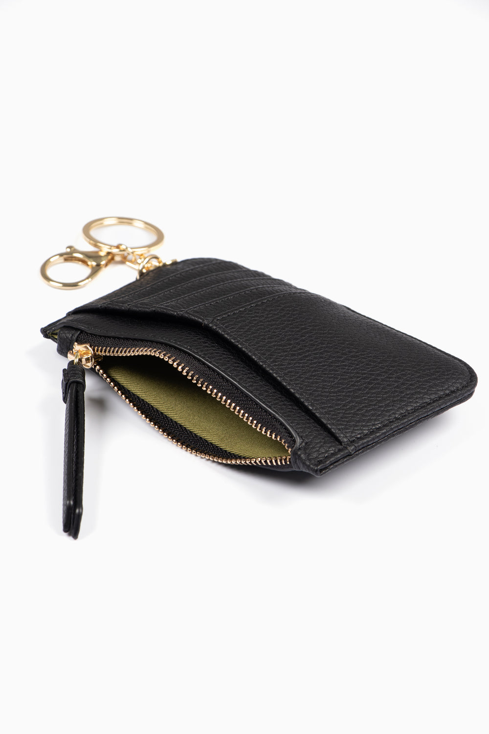 showing the black card holder laying flat, there is an open zip pocket compartment, also showing are the card slots on the outside of the item