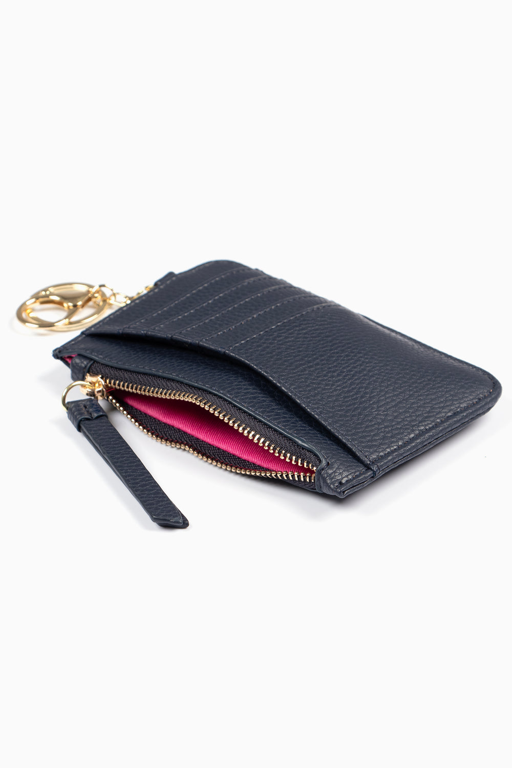 showing the navy blue holder laying flat, there is an open zip pocket compartment, also showing are the card slots on the outside of the item