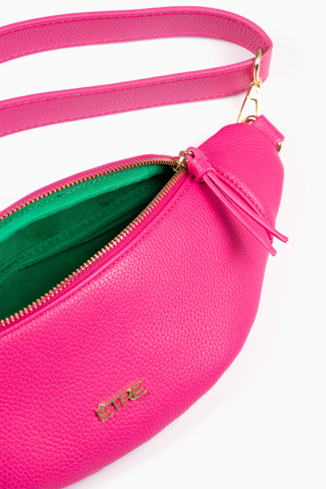 showing the bum bag unzipped and open showing the inner compartment and lining.