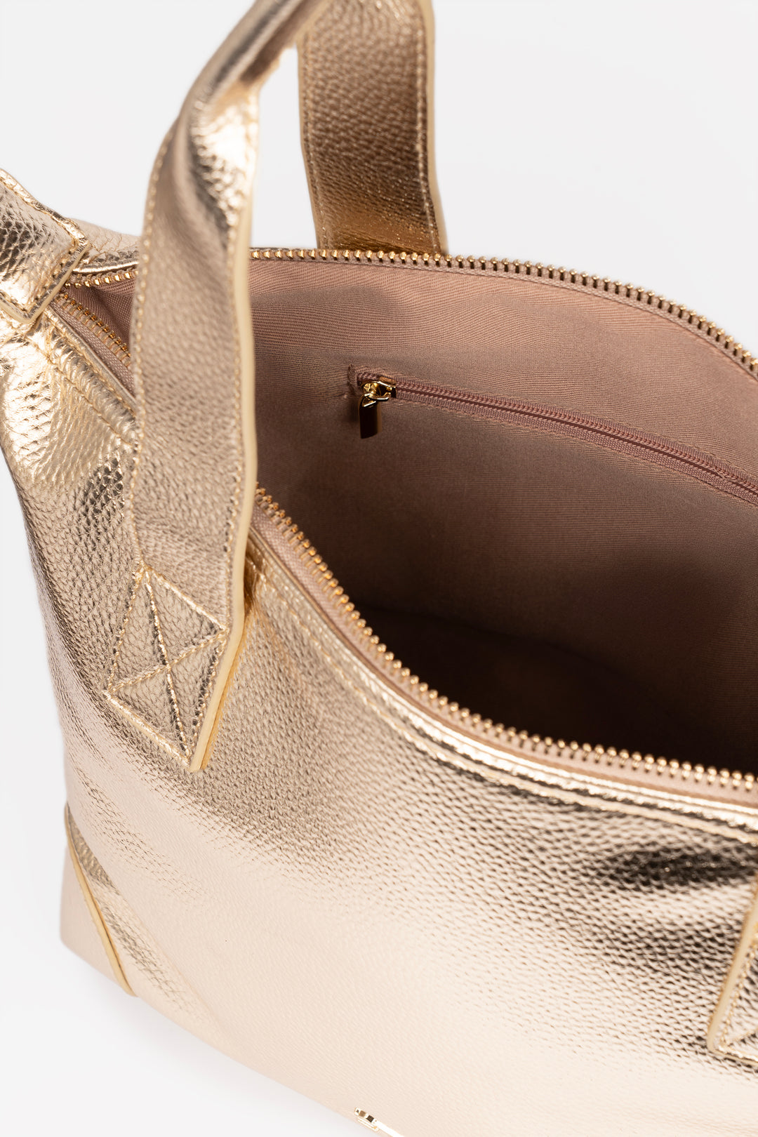 showing the inside of the bag with an internal zip pocket