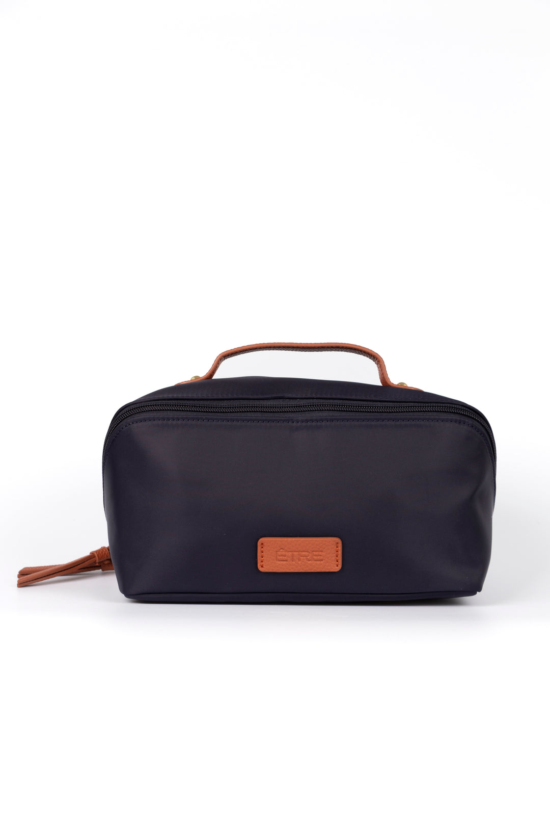 navy blue vanity case with tan faux leather accents and top handle. the cosmetics bag has zip fastening closure.