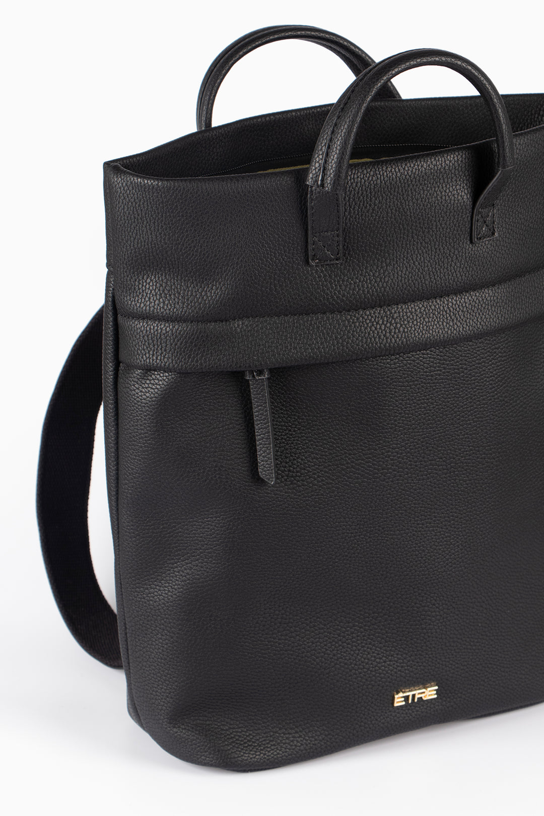 side view showing the front zip pocket compartment on the backpack, the main compartment is also zip closing and is shown open.
