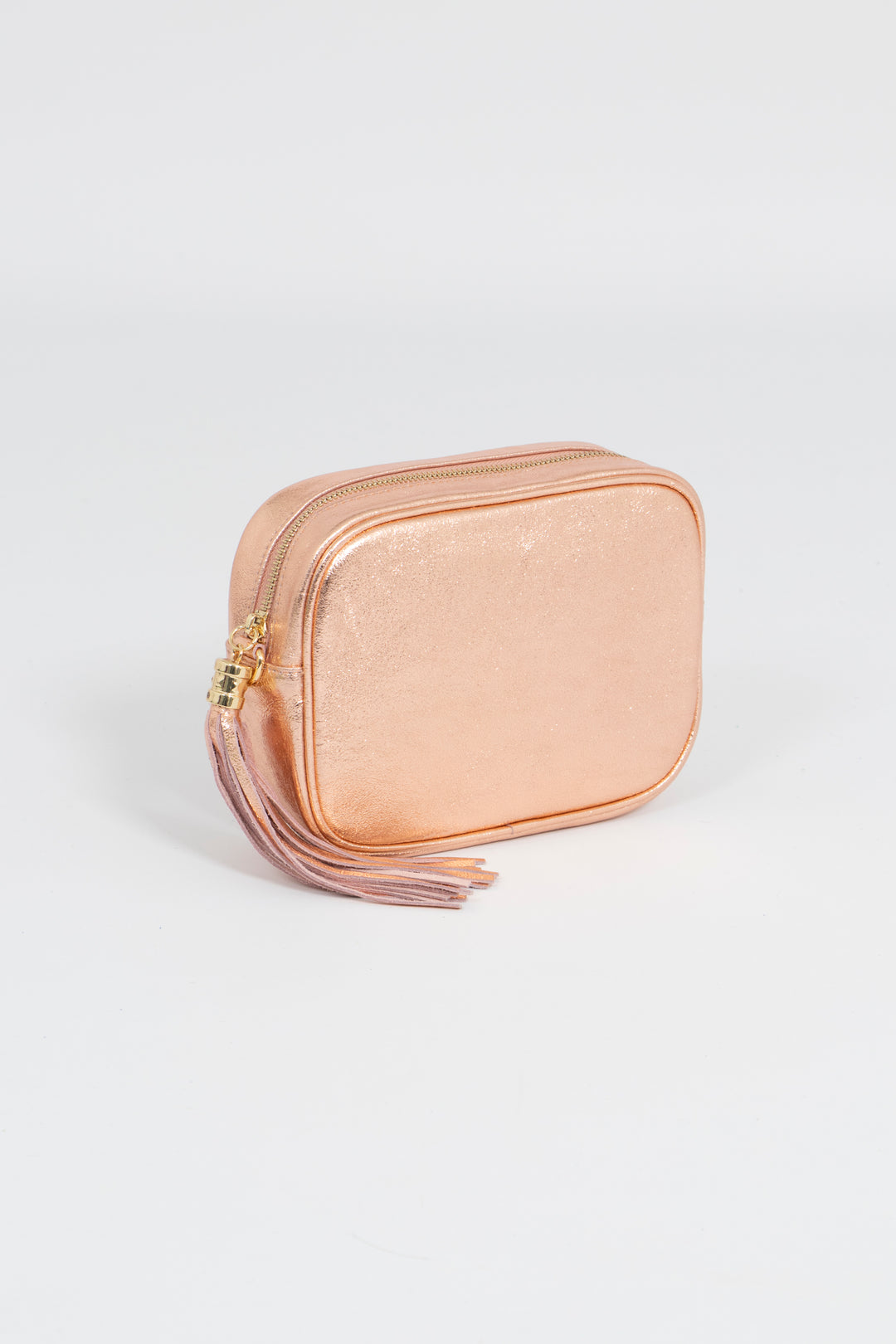 close up showing zip closure of rose gold metallic leather crossbody camera bag