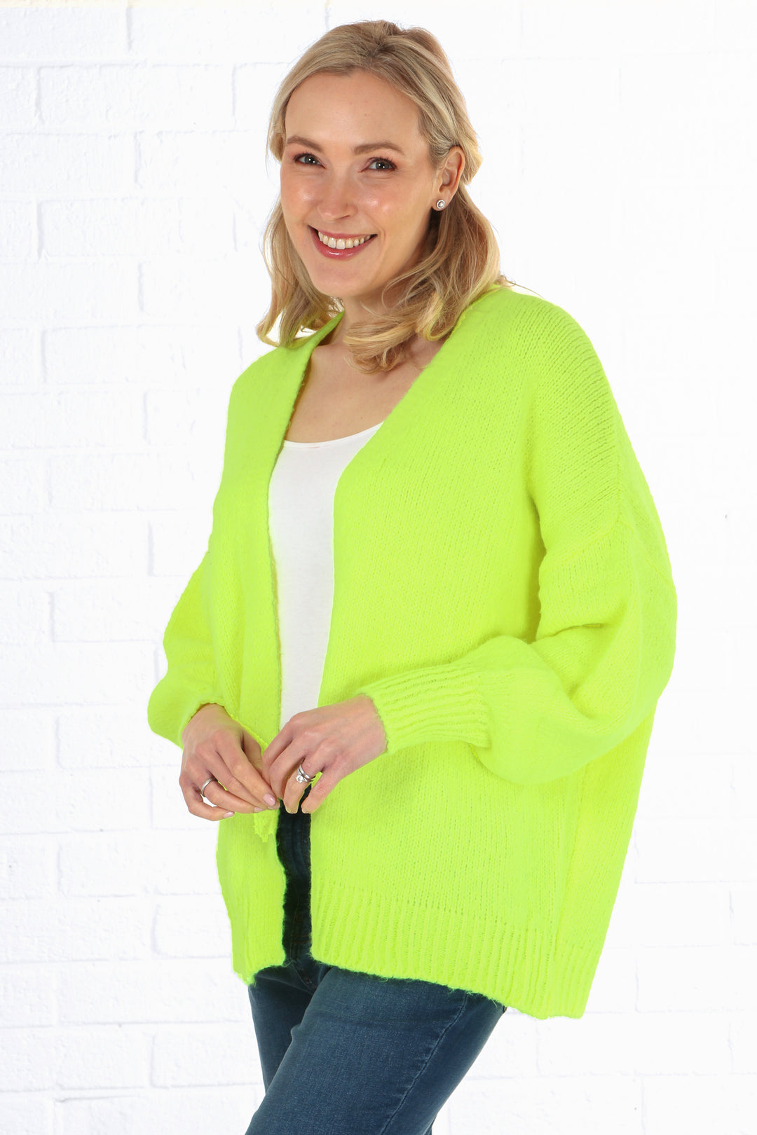 model wearing a neon yellow knitted wool blend short cardigan