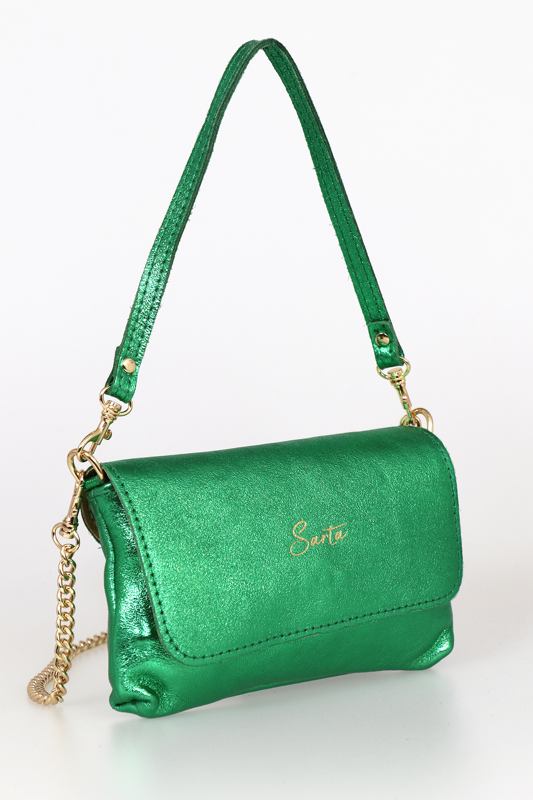 side view of the small cross body bag, showing the folding front closure, gold chain strap and detachable handle strap