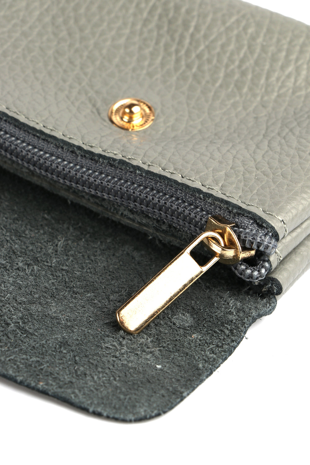 showing the zip closing internal compartment of the grey leather coin purse
