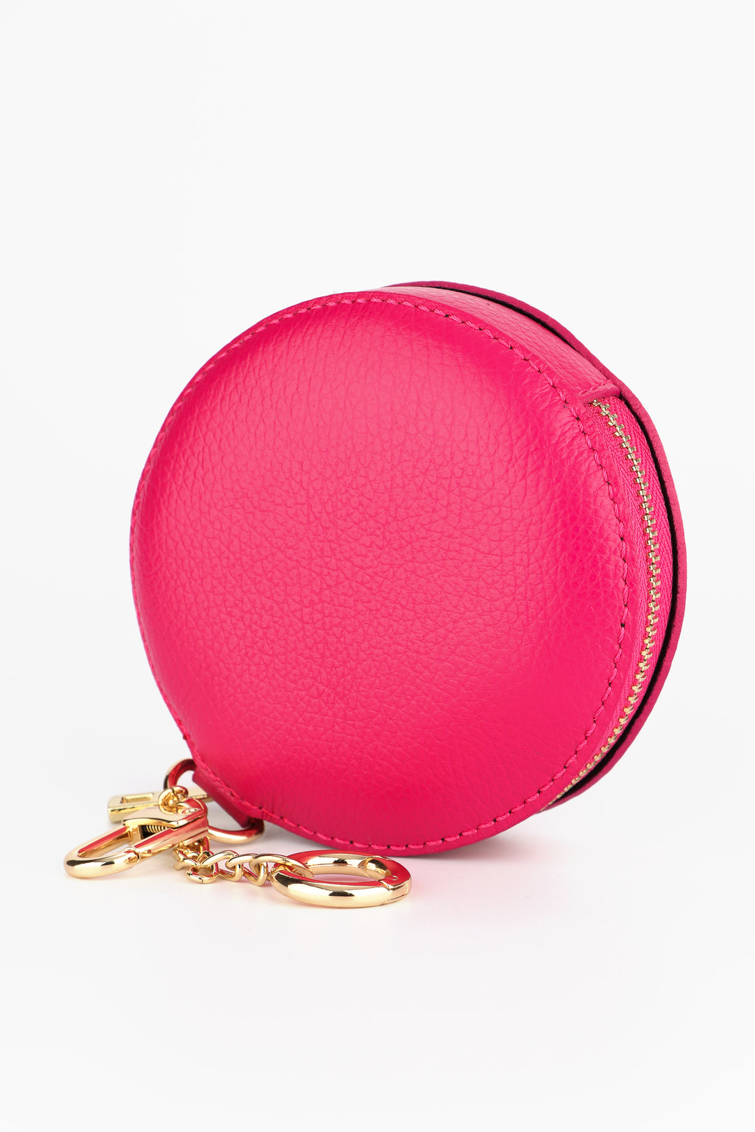 raspberry pink round leather coin purse with a zip closure. the coin purse has two attachment keyrings in gold