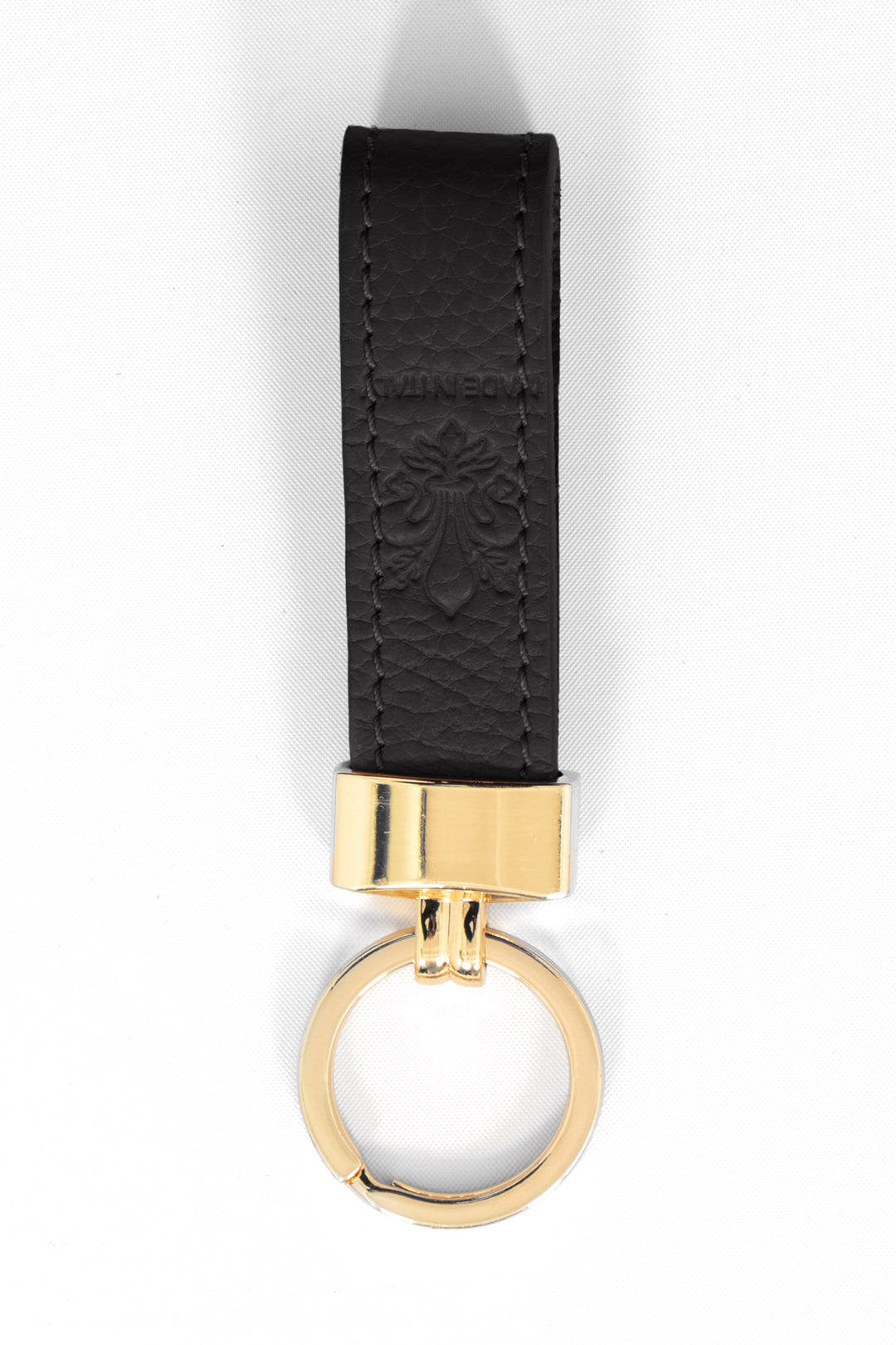 pebbled black leather loop keyring with a gold loop attachment.