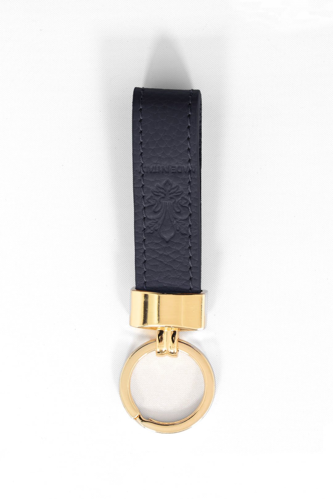 pebbled navy blue leather loop keyring with a gold loop attachment.