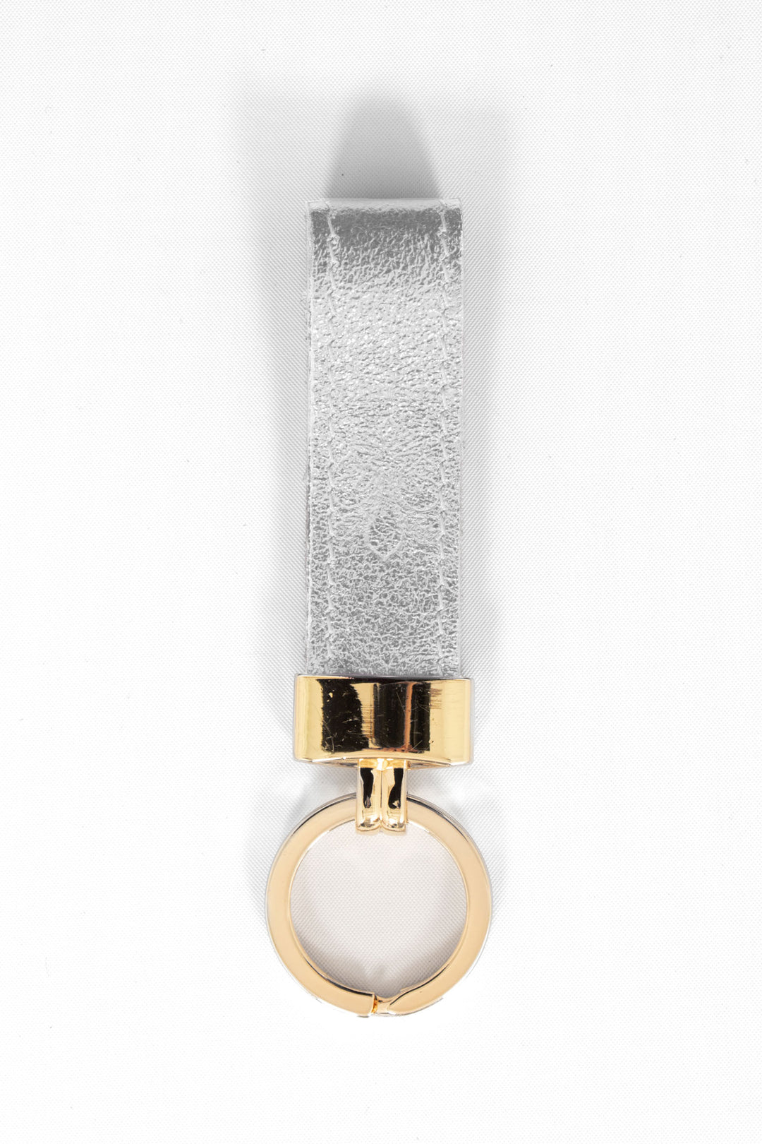 metallic silver leather loop keyring with a gold loop attachment.