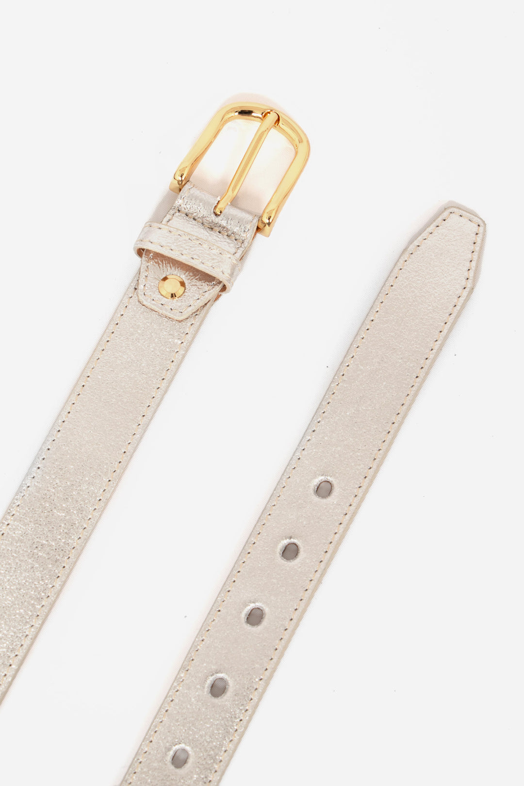 plain silver 3cm metallic leather belt with cut out notches and gold buckle and pin
