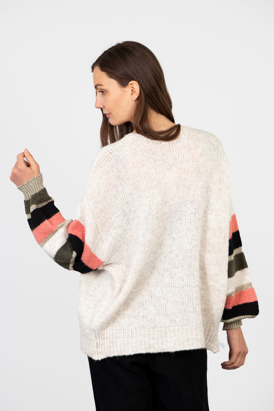 model showing the back of the cardigan, it is plain cream