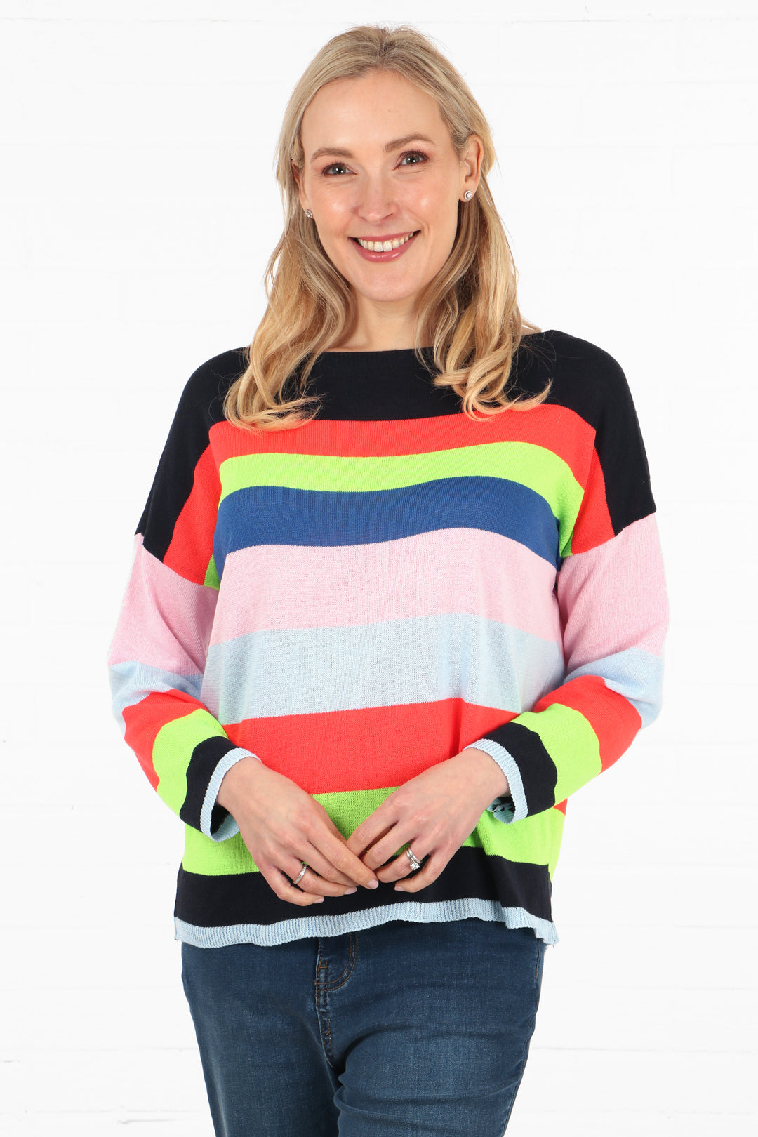 model wearing a colourful mutlicoloured striped long sleeve jumper