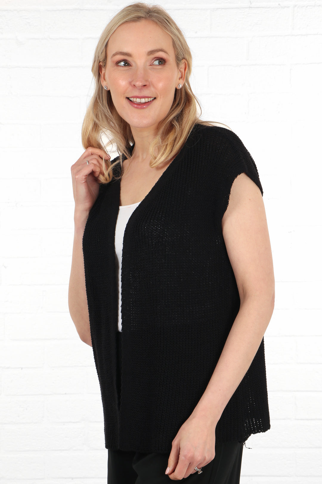 model wearing a navy blue cotton knitted waistcoat in a lightweight summer knit material