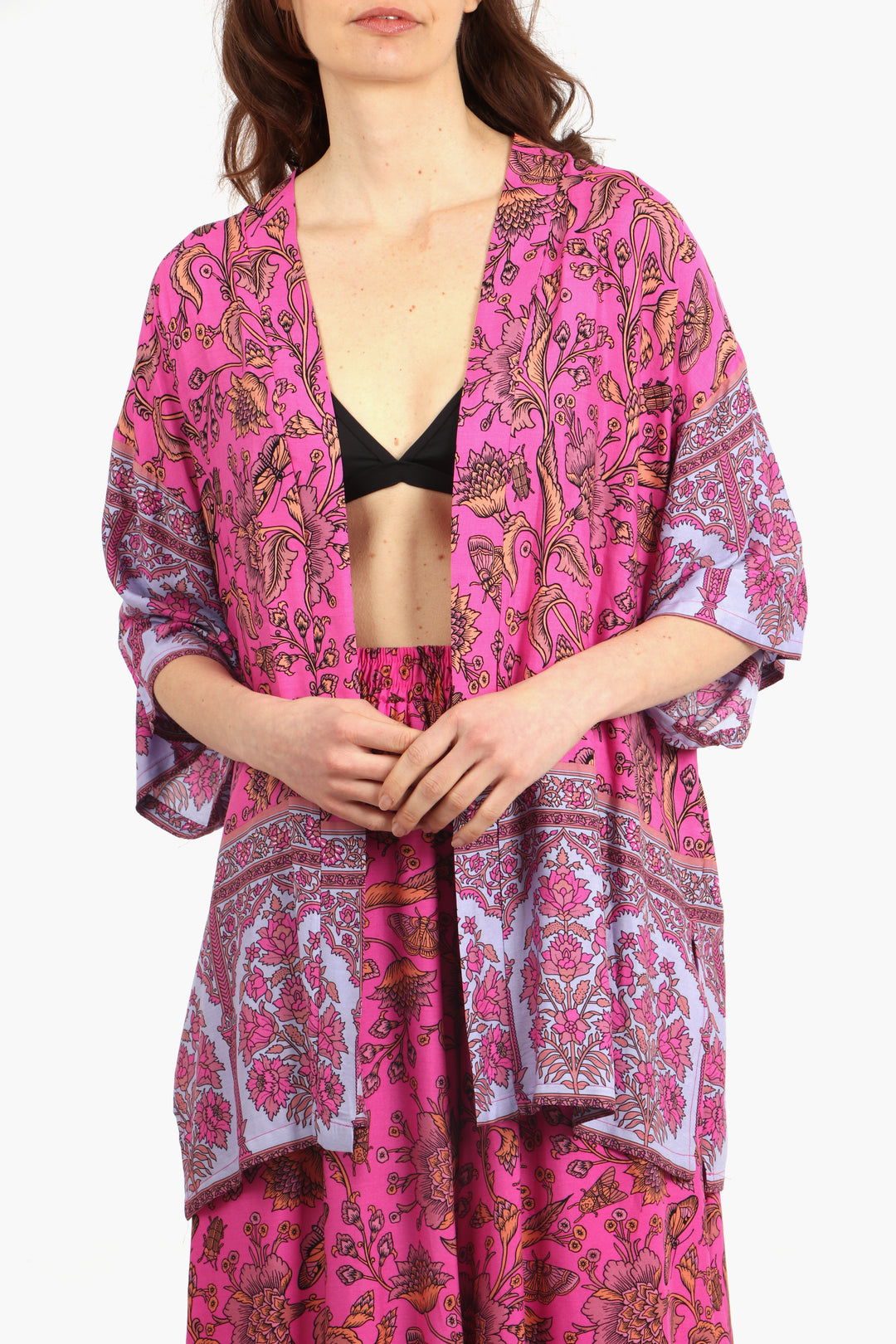 close up of the pink, orange and lilac vintage floral pattern on the short kimono top
