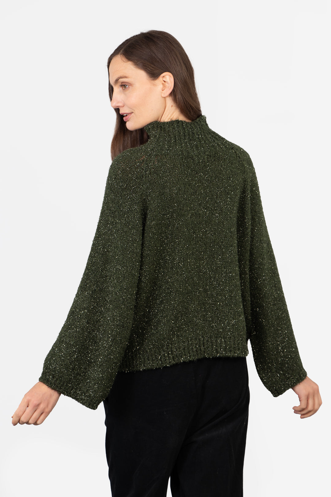 model showing the back of the jumper, it is plain with the all over sparkly glitter effect