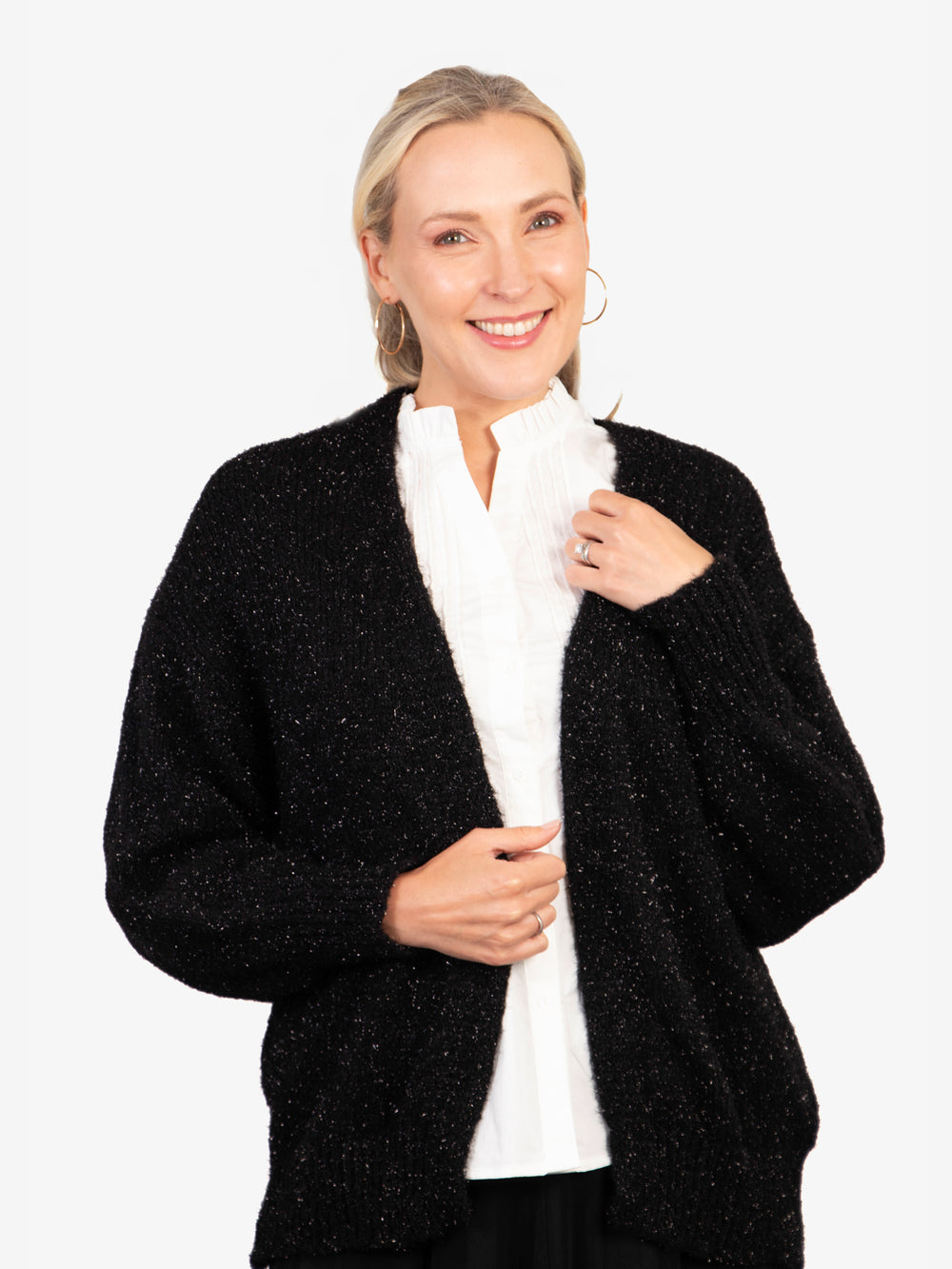 model wearing a gold sparkly tinsel effect knitted cardigan in black