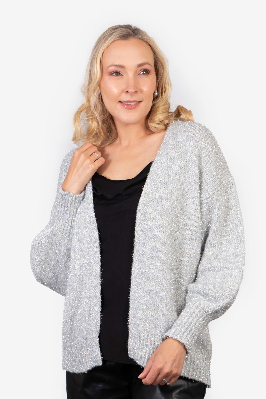 model wearing a gold sparkly tinsel effect knitted cardigan in silver