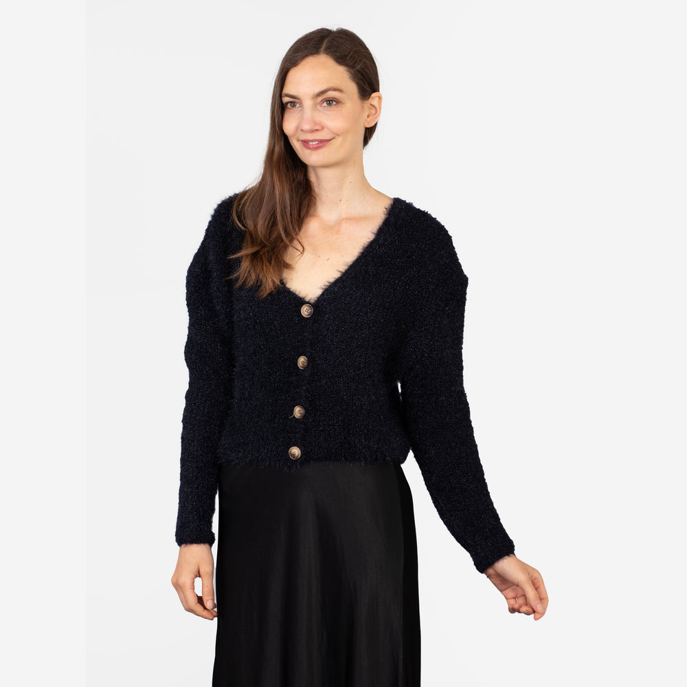 model wearing a navy blue long sleeve cardigan