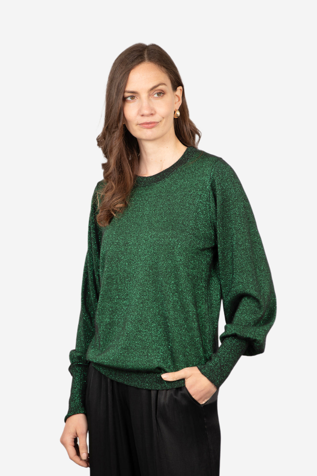 model wearing a long sleeve green sparkly jumper with an all over sparkle and a round neck