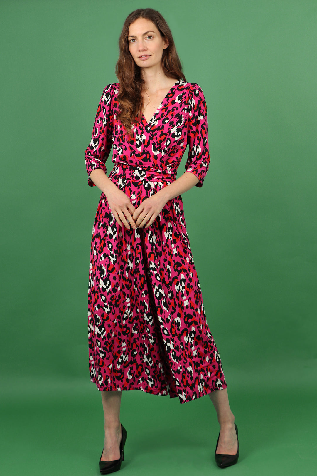 model wearing a pink leopard print cropped jumpsuit with waist tie