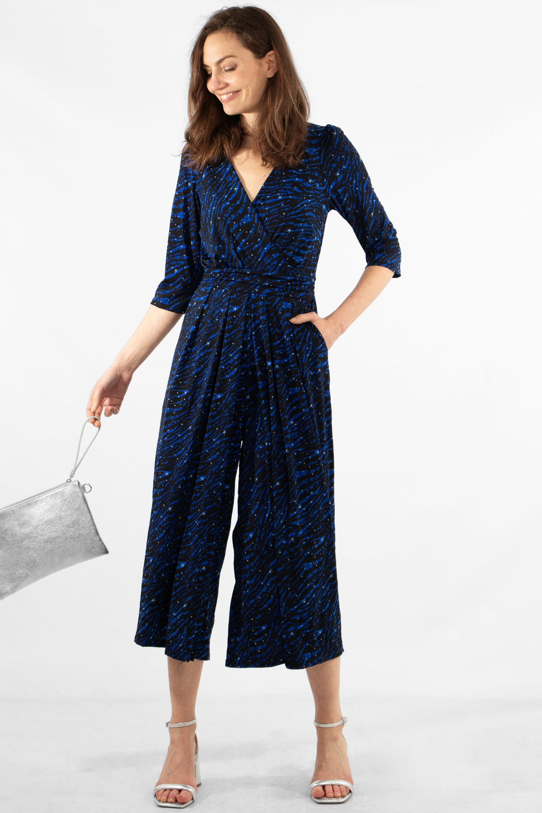 model wearing a blue zebra and star print cropped jumpsuit