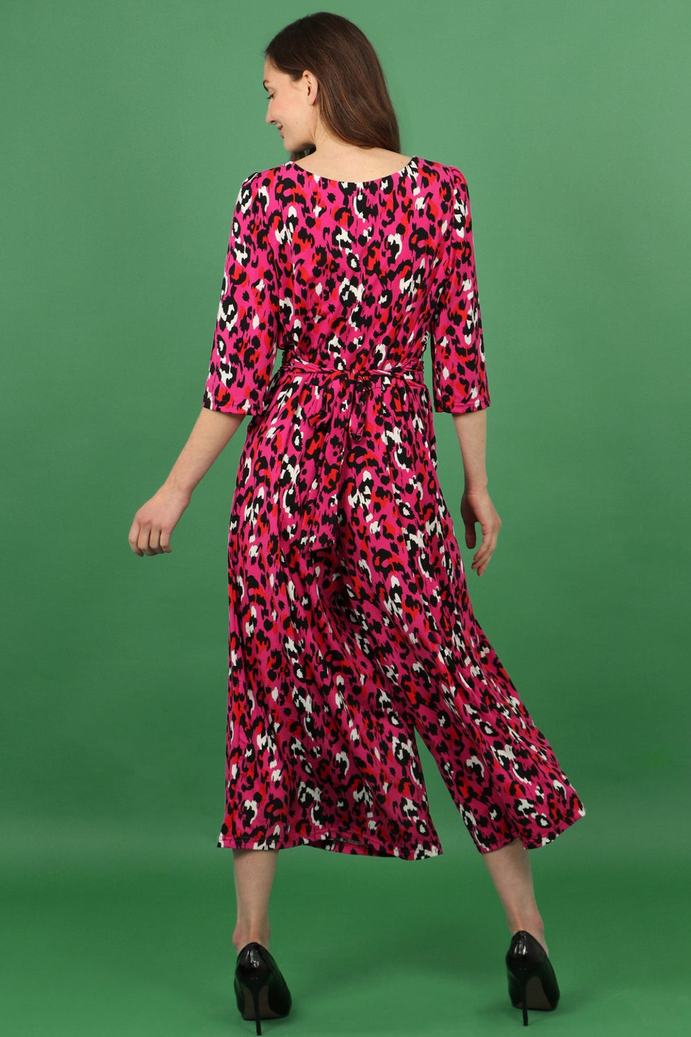 model showing the back of the jumpsuit and waist tie