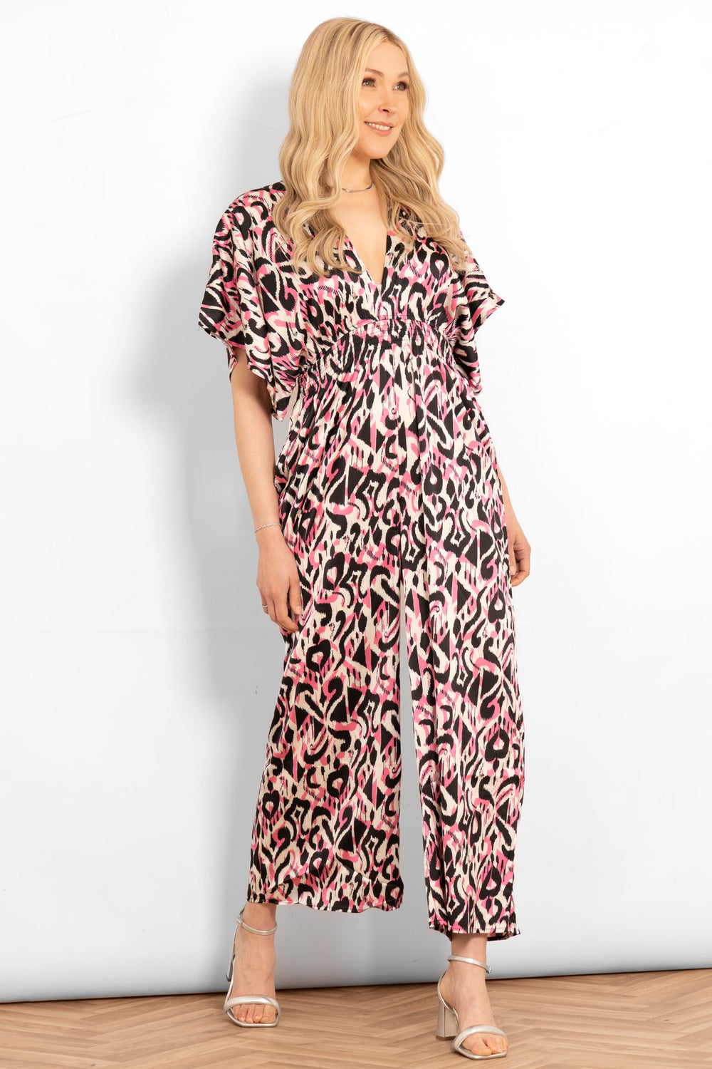 jilly-deep-v-jumpsuit-pink-abstract-ikat-styled-on-model-sandals