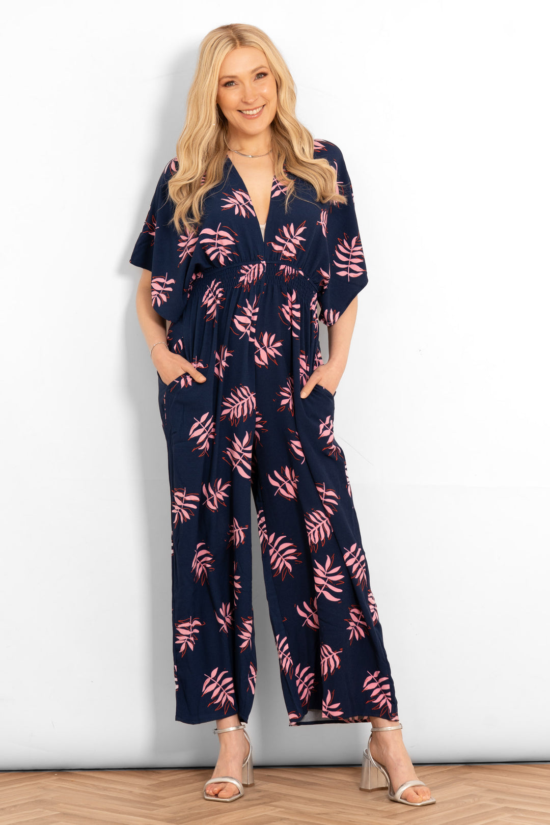 jilly-deep-v-jumpsuit-navy-blue-pink-palm-leaf-model-pockets