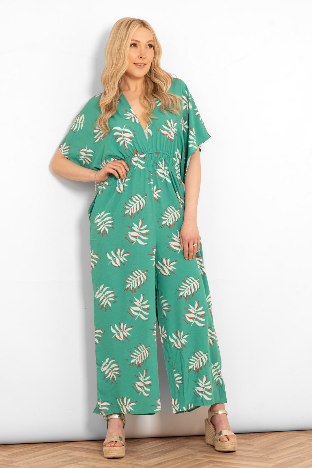 jilly-deep-v-jumpsuit-green-palm-leaf-model-front-view