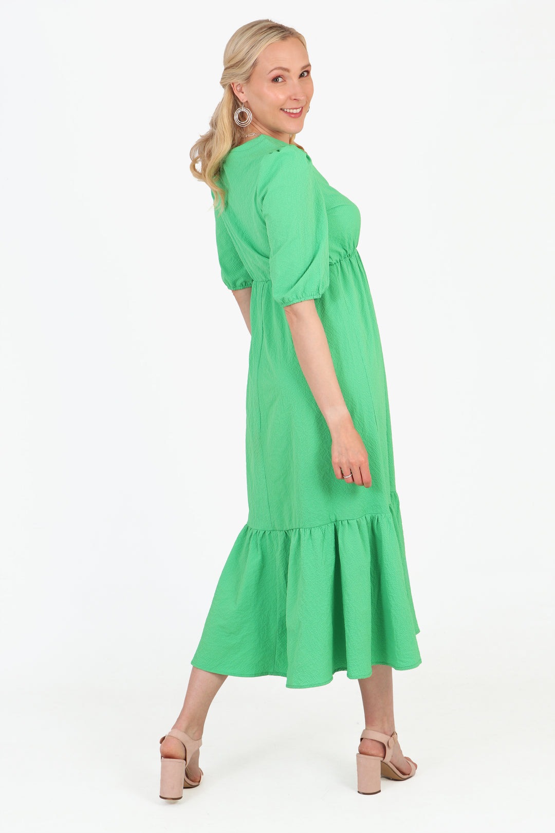 model showing the back of the dress, showing the high neck line at the back