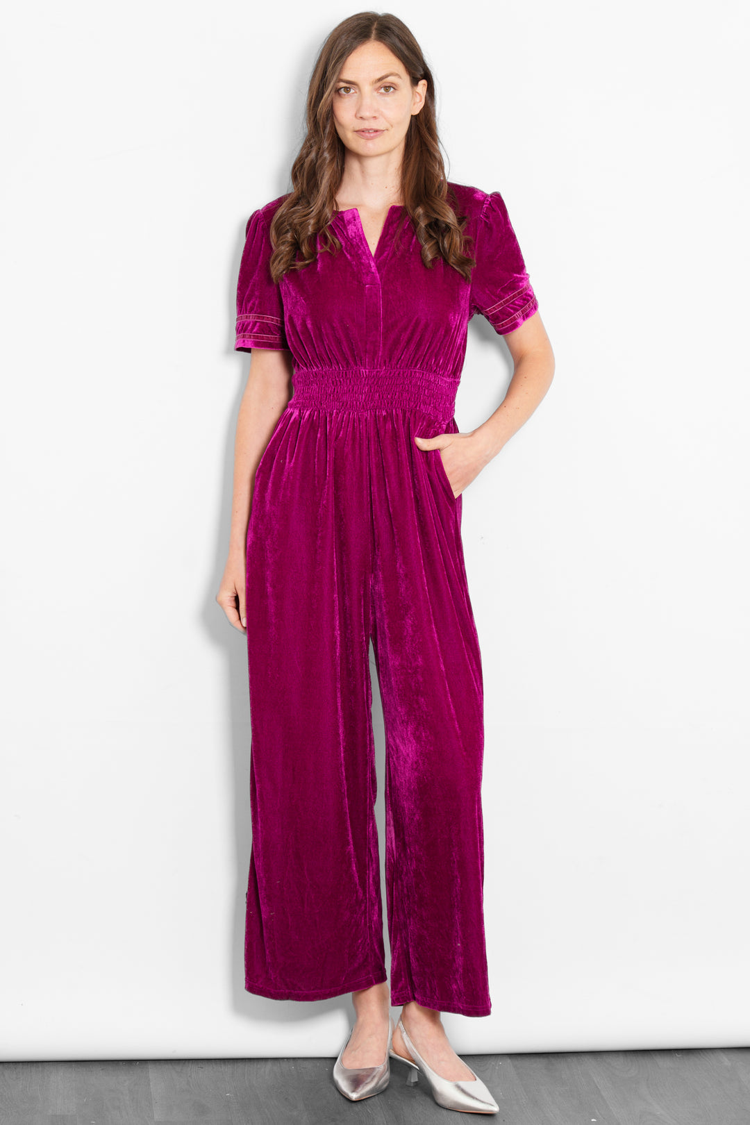 lydia-v-neck-jumpsuit-berry-velvet-model-front-view-pockets