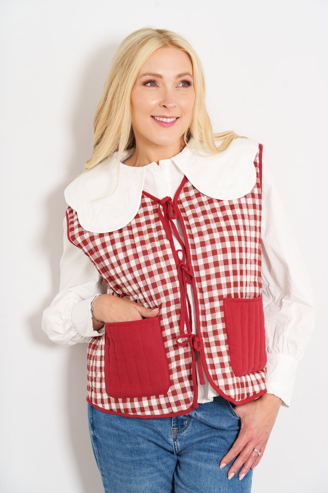 tabby-quilted-reversible-gilet-red-cream-gingham-model-front-view