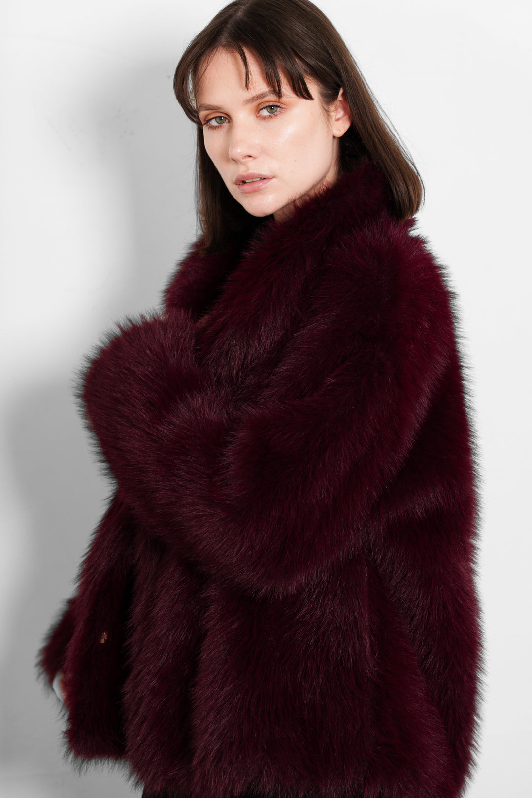 monroe-shawl-collar-jacket-berry-faux-fur-model-side-view-burgundy