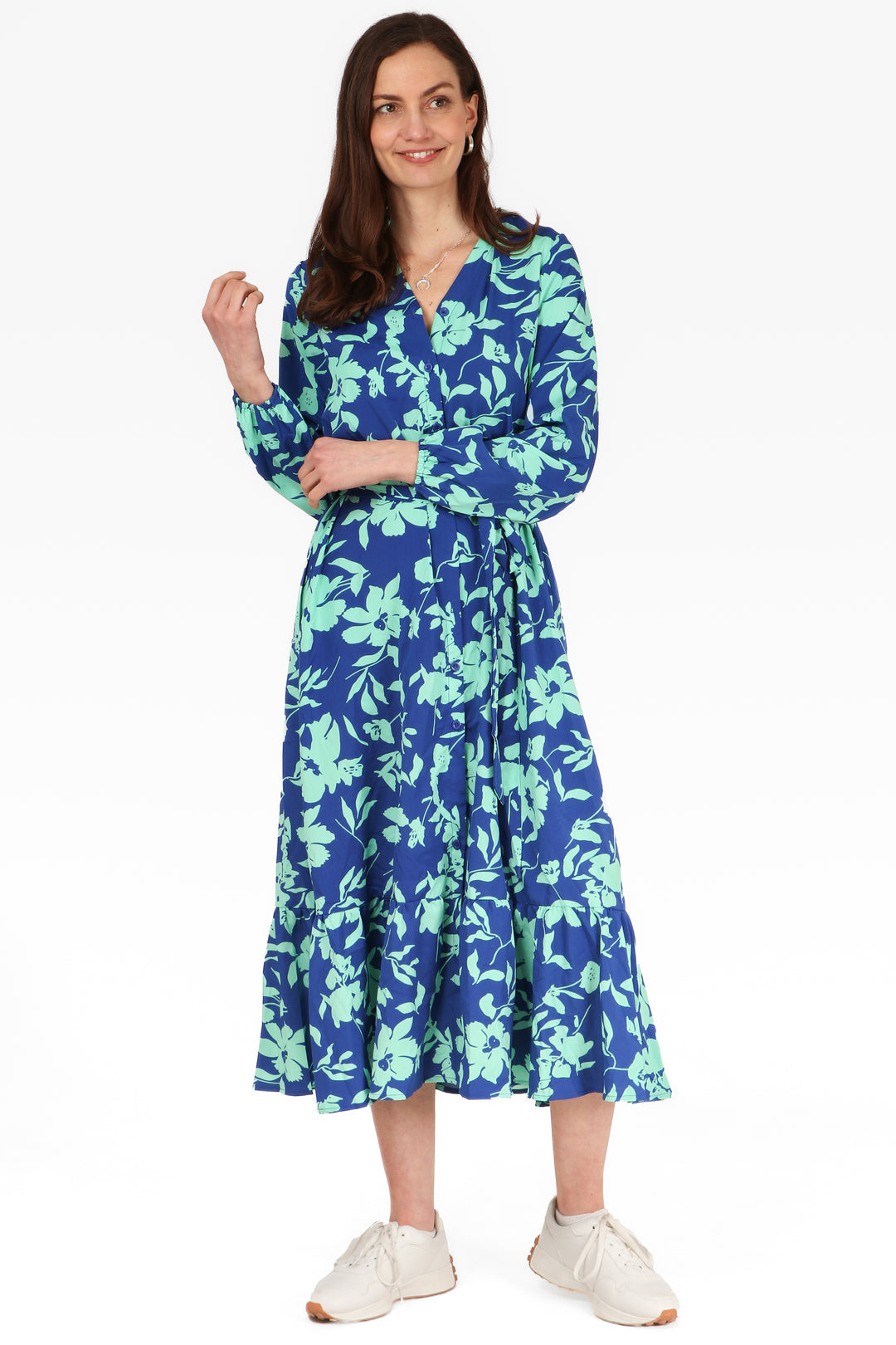 model wearing a blue tropical floral print maxi shirt dress with tiered hem and long sleeves 2