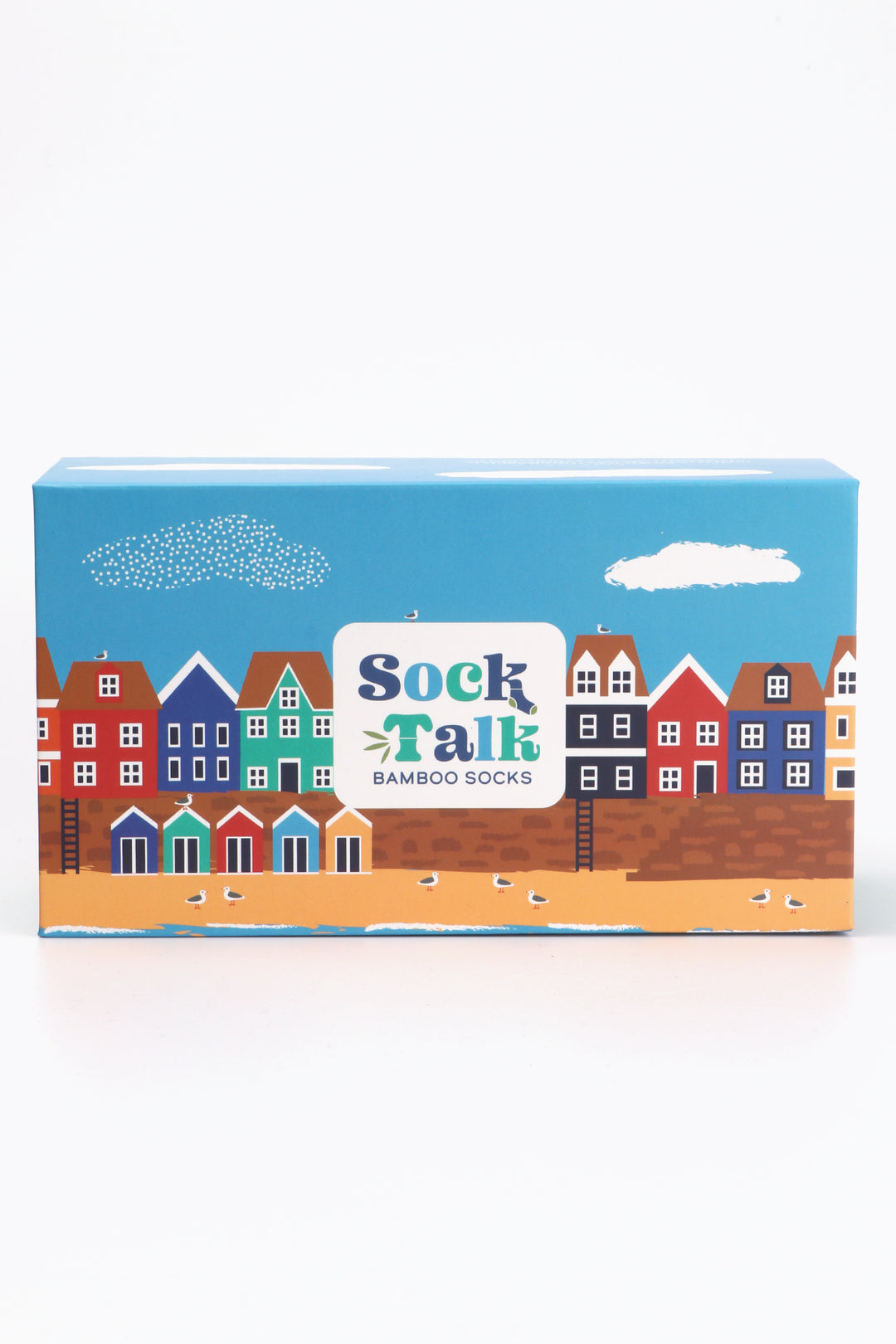 a sock gift box which fits three pairs of bamboo socks artistically designed to look like a seaside village scene with beach and colourful beach huts