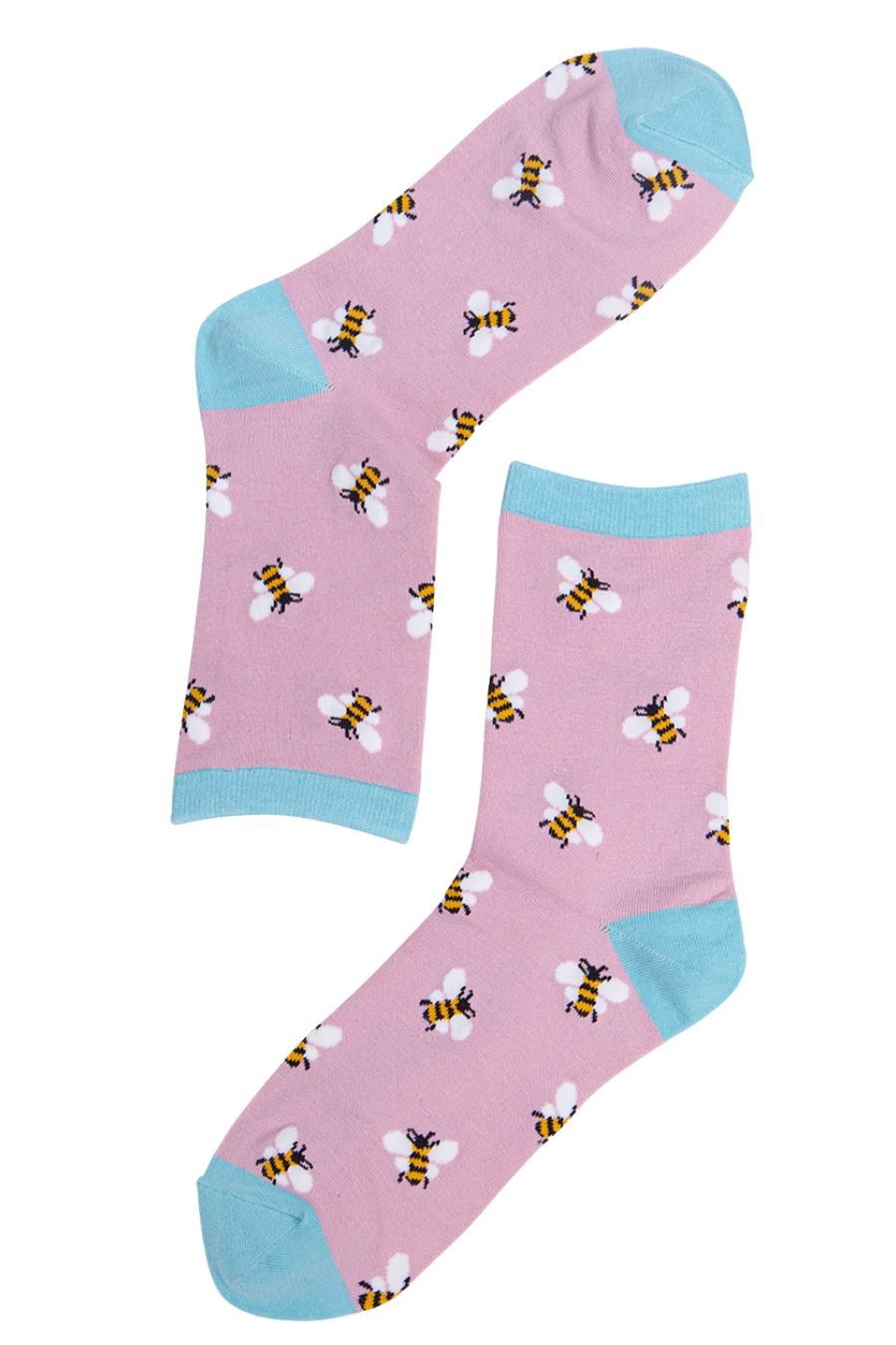 light pink and blue bee socks with an all over pattern of bumblebees