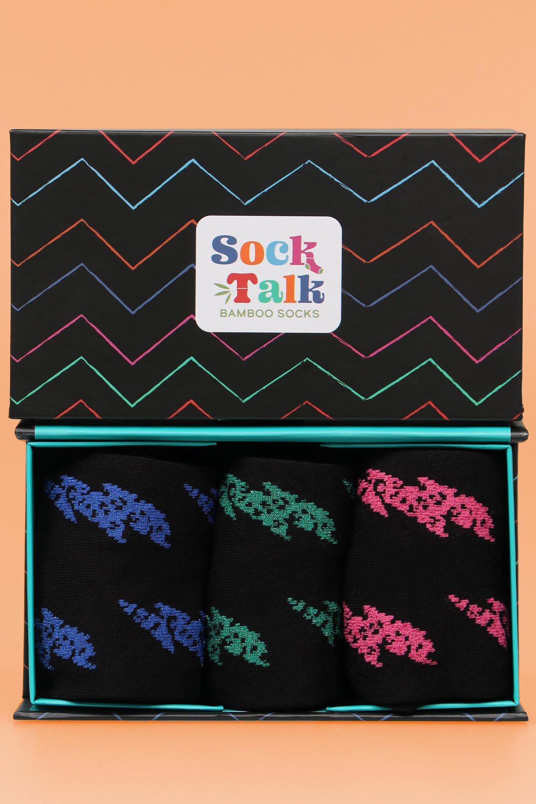 black and multicoloured zig zag pattern gift box with three pairs of sparkly lightning bolt pattern bamboo socks