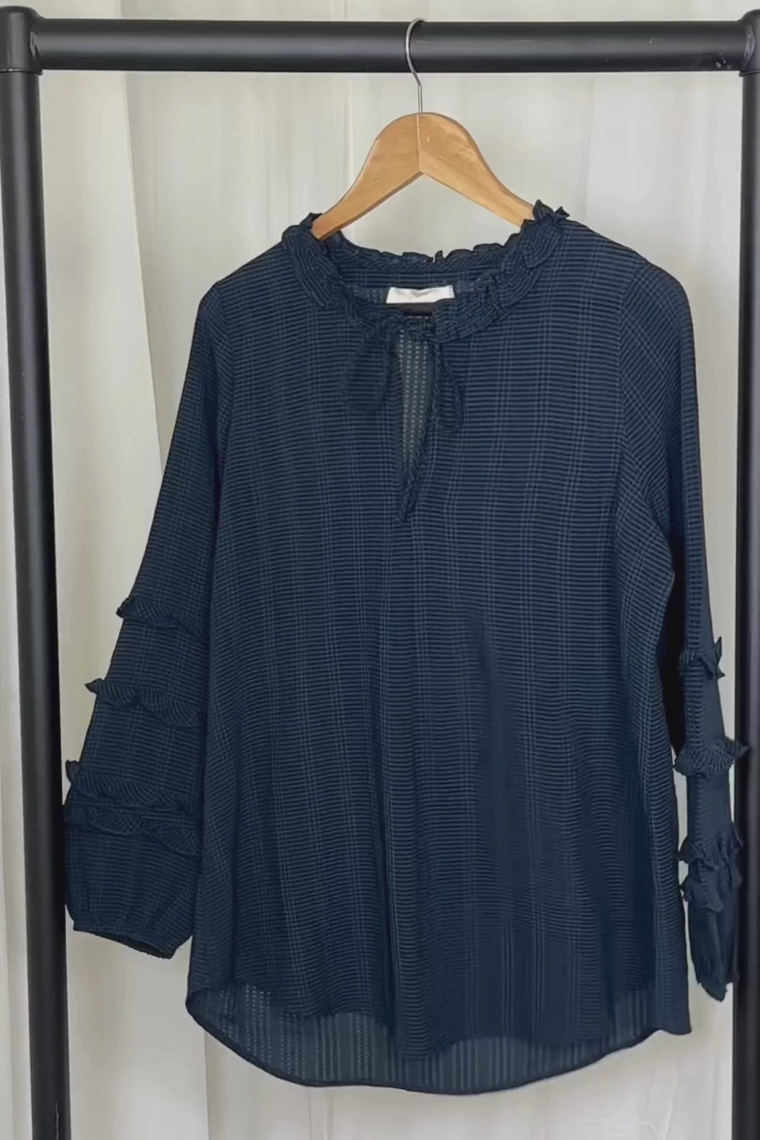 video of the grandad collar shirt, showing the flowy material up close