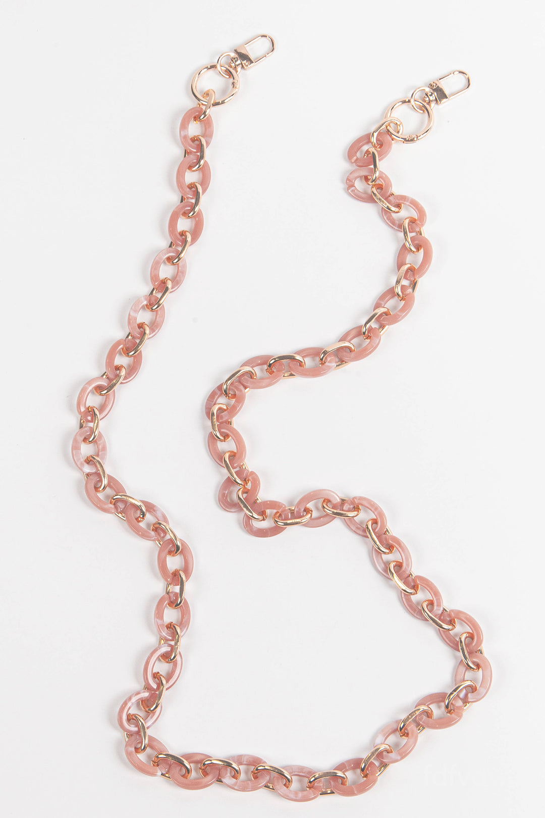 close up of the pink and gold link bag strap