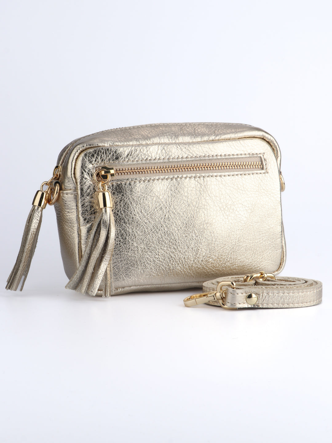 gold leather crossbody camera bag with a front zip pocket and matching detachable bag strap